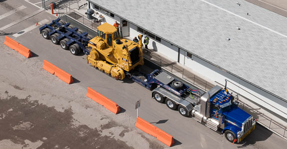 Equipment being transported from a Ritchie Bros. auction